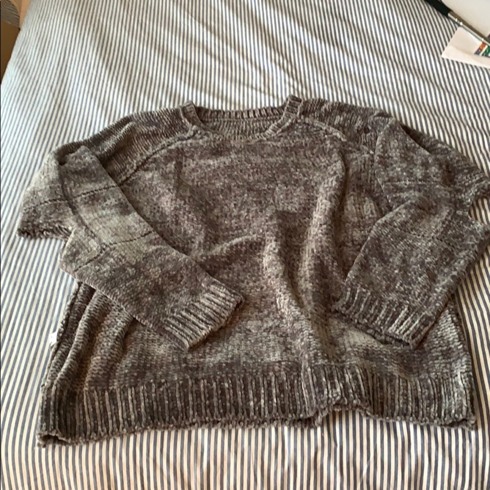 Distressed sweater with holes in elbows